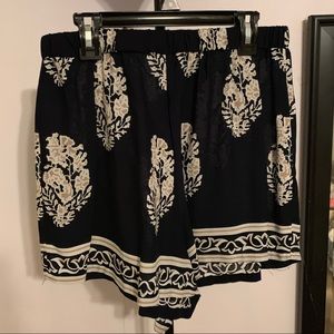 black shorts with white and cream designs